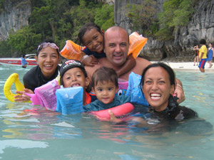 Family fun at Monkey beach, Phi Phi, Thailand